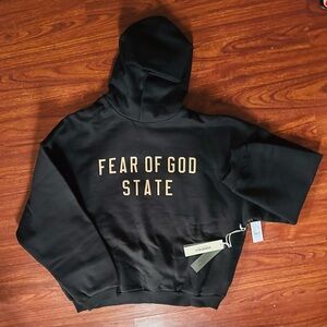 Fear of God Black Hoodie with Gold Text